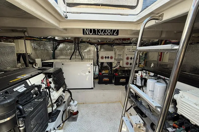 Slide: The Image of Engine room of 2020 Cruisers Yachts 42 Cantius with equipment and ladder. - 13