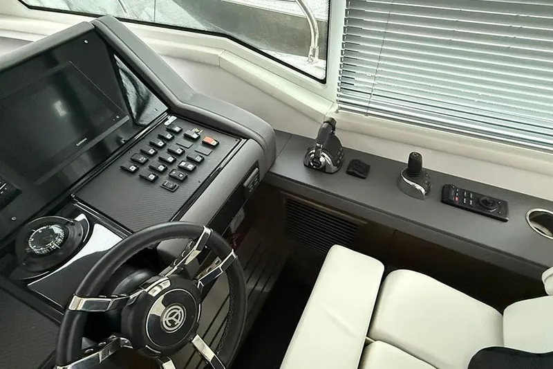 Slide: The Image of Helm of 2020 Cruisers Yachts 42 Cantius with modern controls and steering wheel. - 5