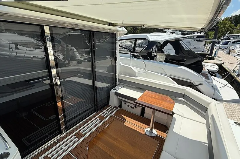 Slide: The Image of 2020 Cruisers Yachts 42 Cantius, featuring sleek deck and modern seating area. - 6