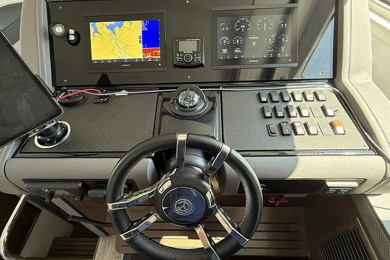 Slide: The Image of Helm of 2020 Cruisers Yachts 42 Cantius with navigation screens and controls. - 3