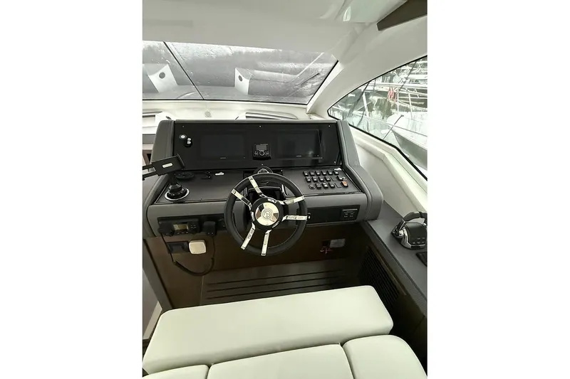 Slide: The Image of Helm of 2020 Cruisers Yachts 42 Cantius with modern controls and steering wheel. - 4