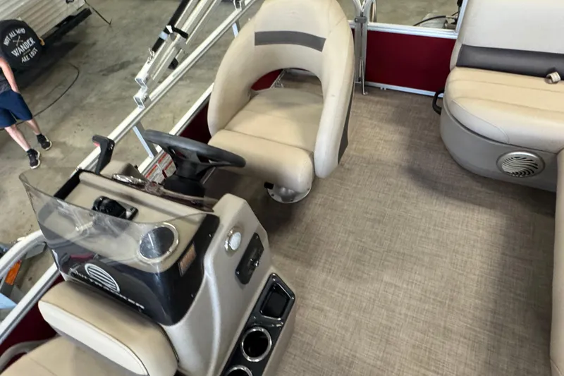 Slide: The Image of 2023 Sun Tracker Bass Buggy 16 XL Select interior with steering console and seating. - 10