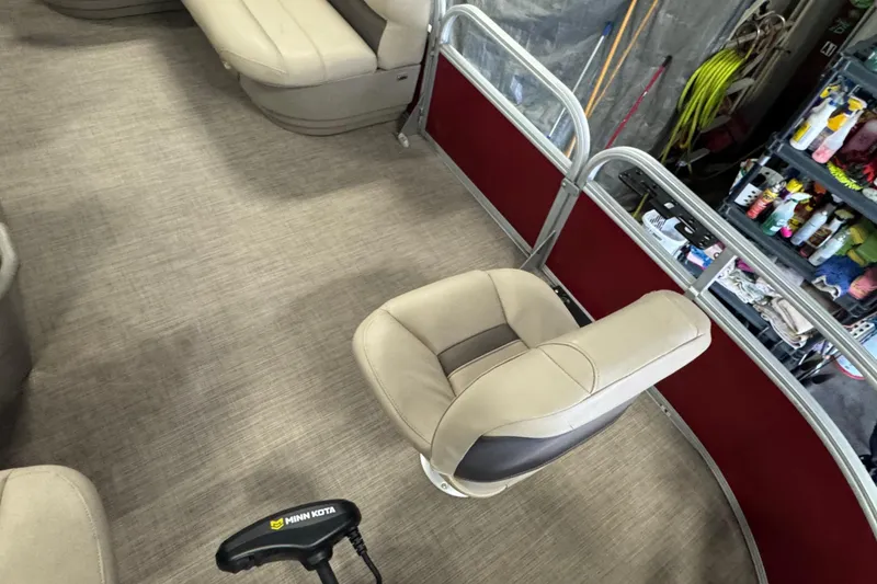 Slide: The Image of 2023 Sun Tracker Bass Buggy 16 XL Select interior with seating and Minn Kota motor. - 8