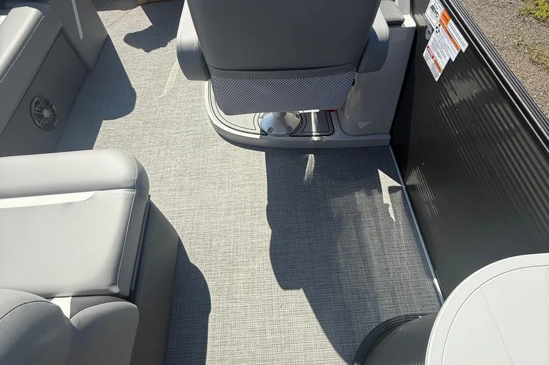 Slide: The Image of Interior of 2025 Crest Classic 200 boat with gray seating and flooring. - 10