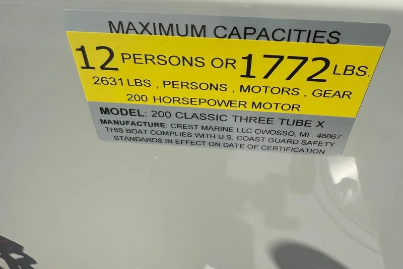 Slide: The Image of Capacity label for Crest Classic 200, 2025 model, 12 persons or 1772 lbs, 200 horsepower motor. - 14