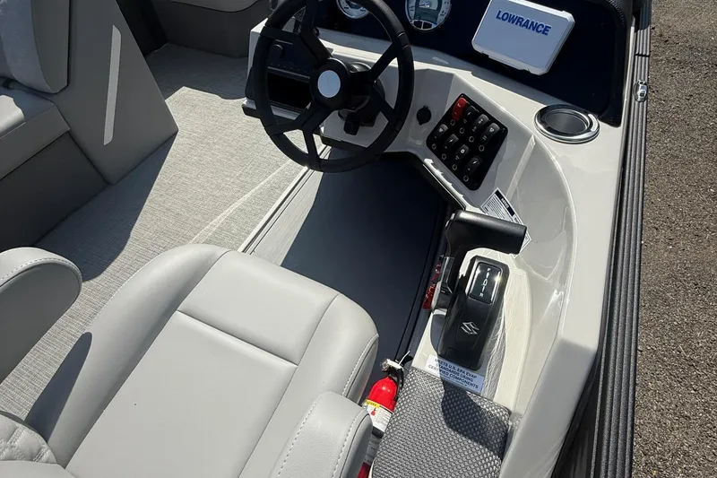 Slide: The Image of Interior of 2025 Crest Classic 200 boat with steering wheel and control panel. - 29