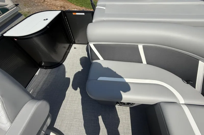 Slide: The Image of 2025 Crest Classic 200 boat interior with gray seating and flooring. - 31