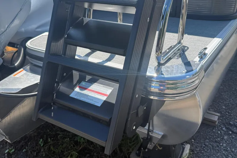 Slide: The Image of 2025 Crest Classic 200 boat ladder with chrome accents in sunlight. - 4