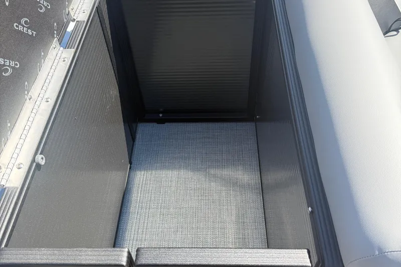 Slide: The Image of Interior storage compartment of 2025 Crest Classic 200 boat, featuring sleek design and durable materials. - 7