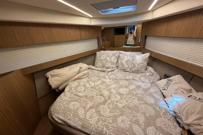 Slide: The Image of Luxurious bedroom interior of 2018 Chris-Craft Commander 44 yacht with elegant bedding. - 16