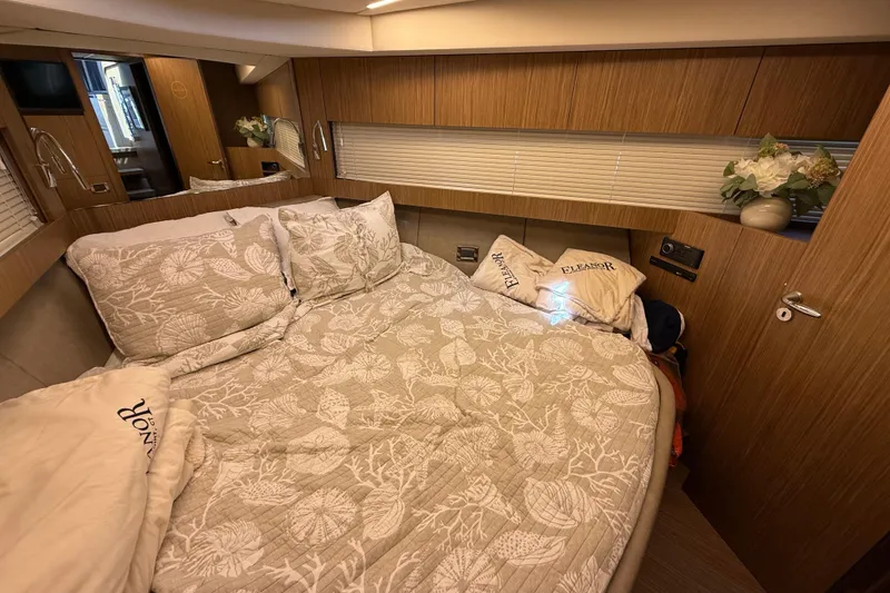 Slide: The Image of Luxurious bedroom interior of 2018 Chris-Craft Commander 44 yacht with elegant bedding. - 17