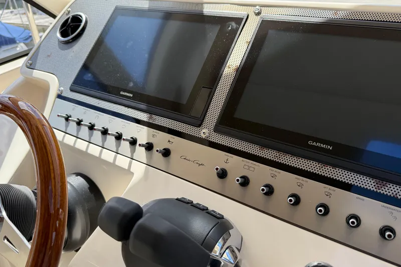 Slide: The Image of 2018 Chris-Craft Commander 44 helm with Garmin displays and control panel. - 20