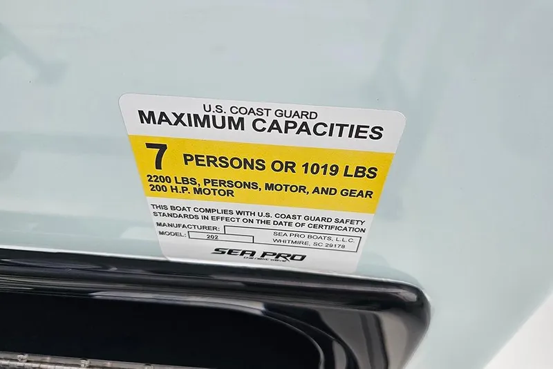 Slide: The Image of 2026 Sea Pro 202 Center Console capacity label, 7 persons or 1019 lbs, 2200 lbs total. - 15