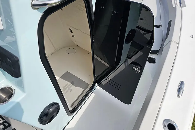Slide: The Image of 2026 Sea Pro 202 Center Console boat interior with open storage compartment. - 17
