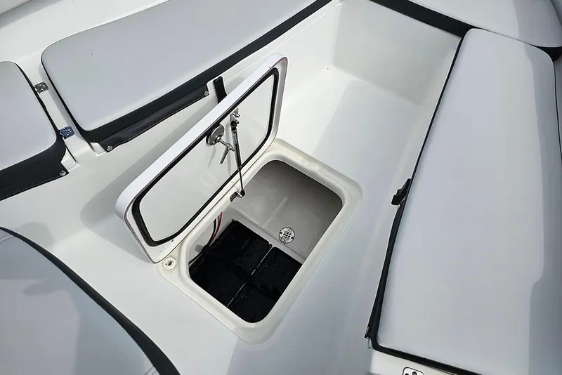 Slide: The Image of 2026 Sea Pro 202 Center Console boat storage compartment with open hatch. - 20