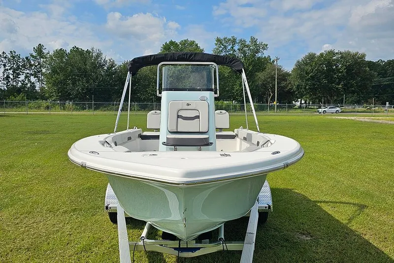 Slide: The Image of 2026 Sea Pro 202 Center Console boat on trailer, displayed on grassy field. - 3
