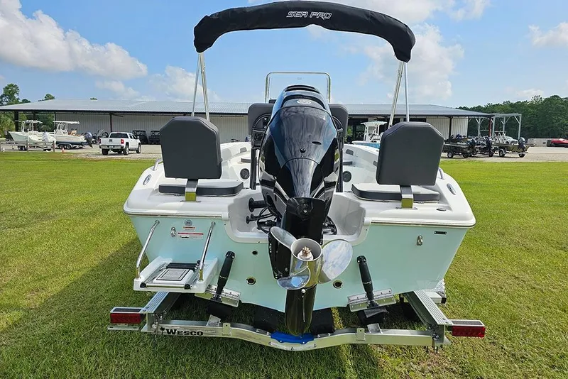 Slide: The Image of 2026 Sea Pro 202 Center Console boat on trailer, rear view, outdoors. - 7