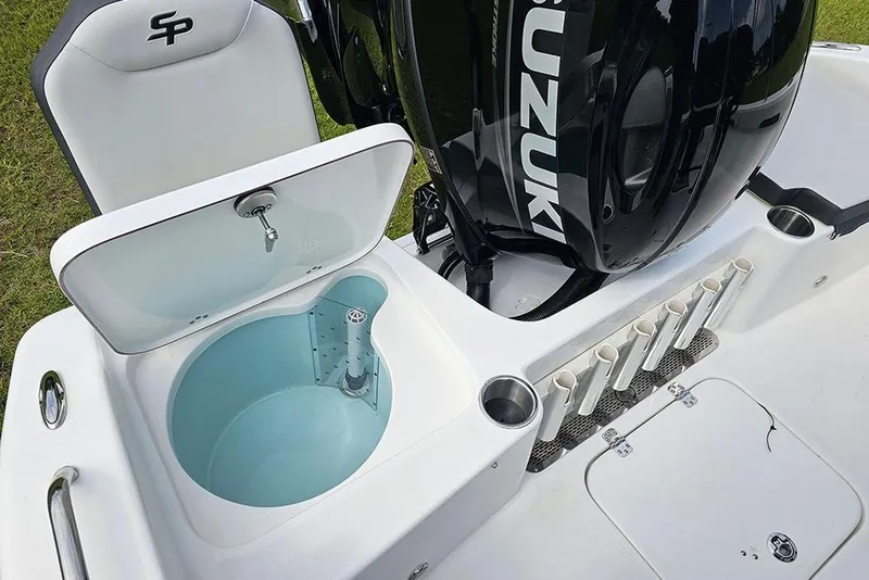 Slide: The Image of 2026 Sea Pro 202 Center Console boat with open livewell and Suzuki outboard engine. - 9