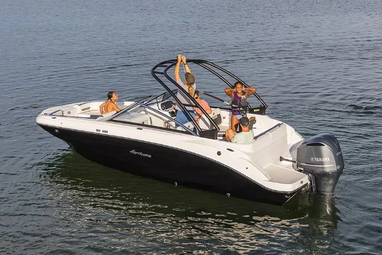Slide: The Image of Manufacturer Provided Image: 2023 Hurricane SunDeck 235 OB boat on water with passengers enjoying. - 19