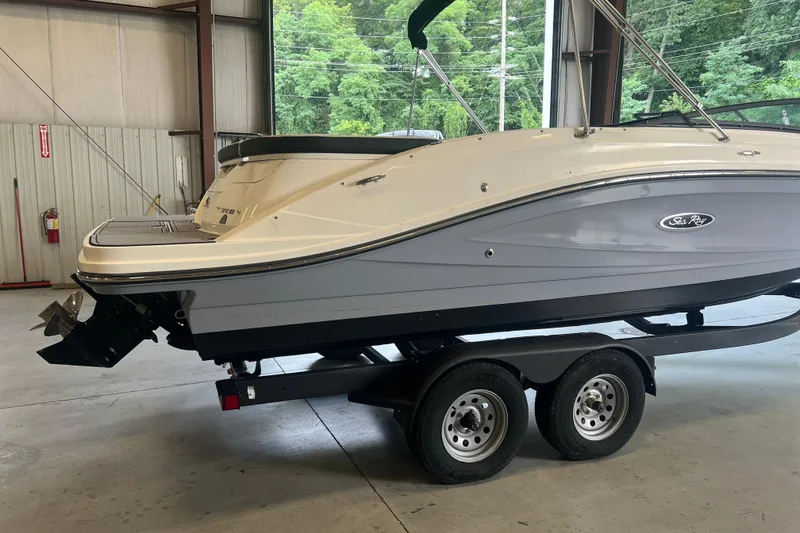 Slide: The Image of 2021 Sea Ray SPX 230 boat on trailer in indoor storage facility. - 3