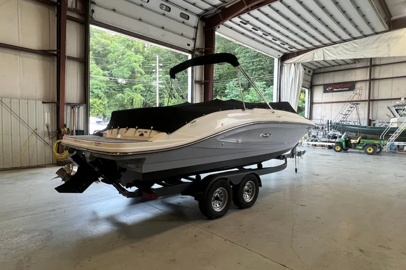 Slide: The Image of 2021 Sea Ray SPX 230 boat on trailer in indoor storage facility. - 4