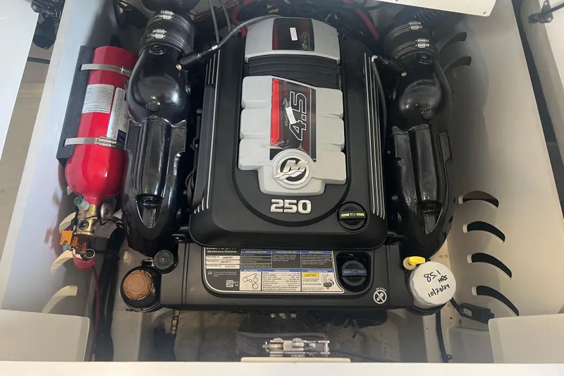 Slide: The Image of Engine compartment of 2021 Sea Ray SPX 230 boat with fire extinguisher. - 7
