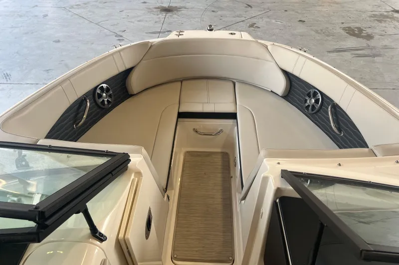 Slide: The Image of 2021 Sea Ray SPX 230 boat interior with beige seating and modern design. - 8