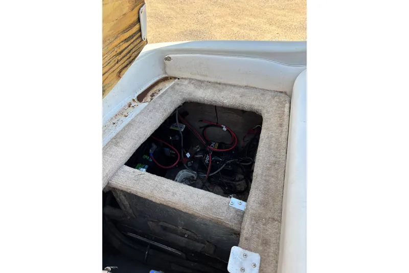 Slide: The Image of Open engine compartment of 2000 Crownline 180 BR boat, showing wiring and battery setup. - 10