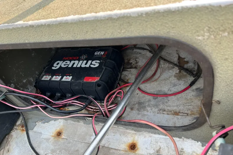 Slide: The Image of NOCO Genius GEN3 battery charger inside 2011 Tracker 1754 boat compartment. - 13