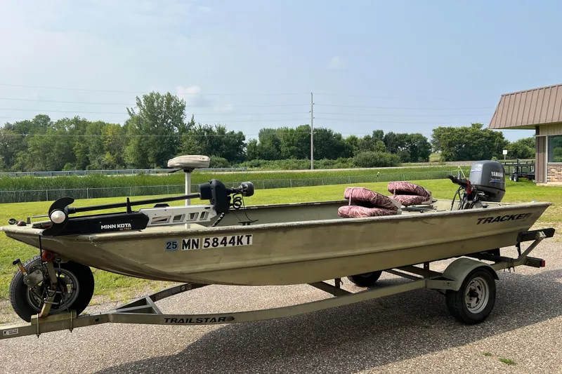Slide: The Image of 2011 Tracker 1754 boat on trailer with Yamaha motor and Minn Kota trolling motor. - 3