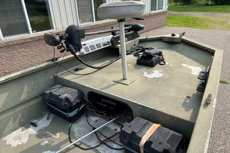 Slide: The Image of 2011 Tracker 1754 boat interior with trolling motor and battery setup. - 4