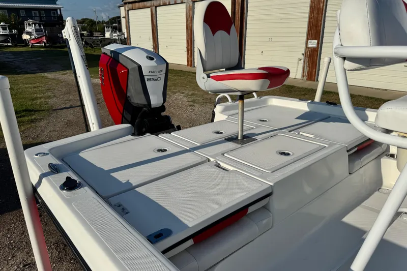Slide: The Image of 2015 Epic 22 Sport Console boat with Evinrude 250 engine and red-white seating. - 13