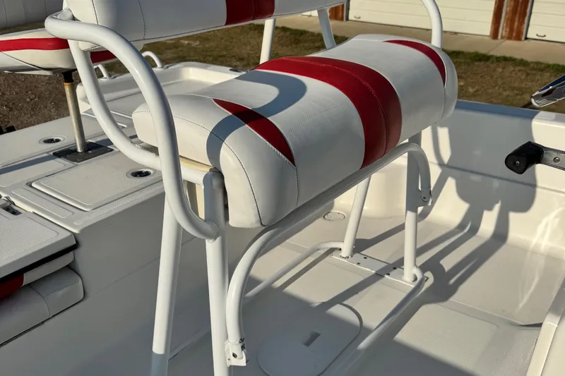 Slide: The Image of 2015 Epic 22 Sport Console boat with red and white seating detail. - 14