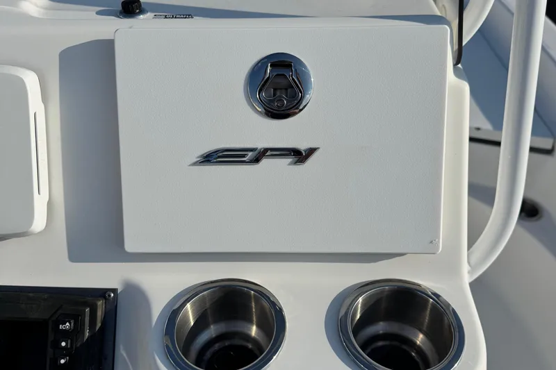 Slide: The Image of Control panel of 2015 Epic 22 Sport Console boat with cup holders. - 21