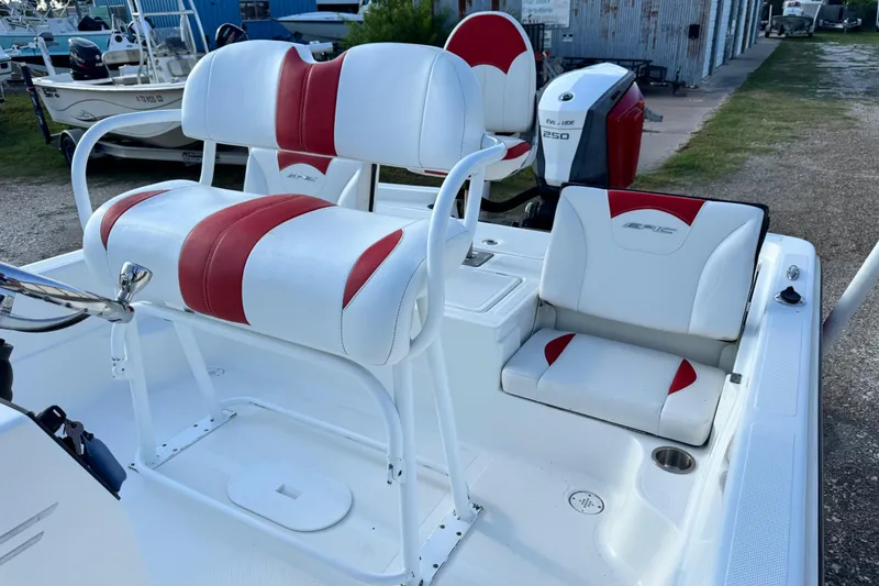 Slide: The Image of 2015 Epic 22 Sport Console boat interior with red and white seating. - 25