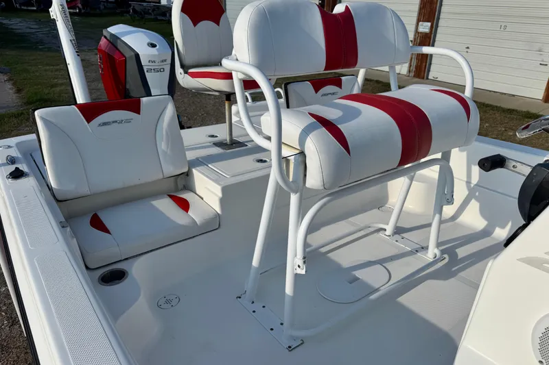 Slide: The Image of 2015 Epic 22 Sport Console boat interior with red and white seating. - 26