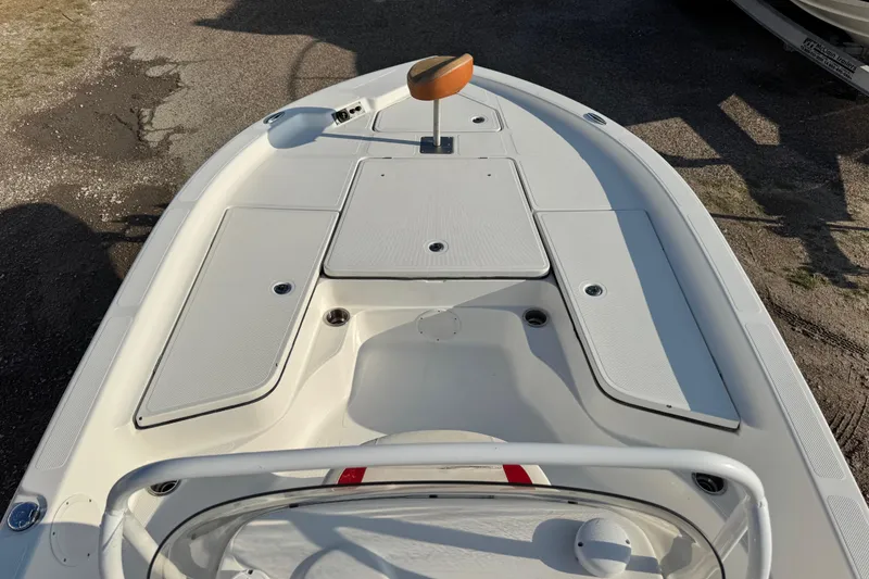 Slide: The Image of 2015 Epic 22 Sport Console boat deck with storage compartments and seating. - 31