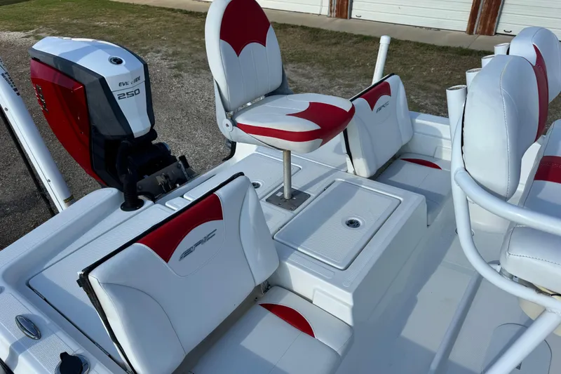 Slide: The Image of 2015 Epic 22 Sport Console boat with Evinrude 250 engine, featuring red and white seating. - 40