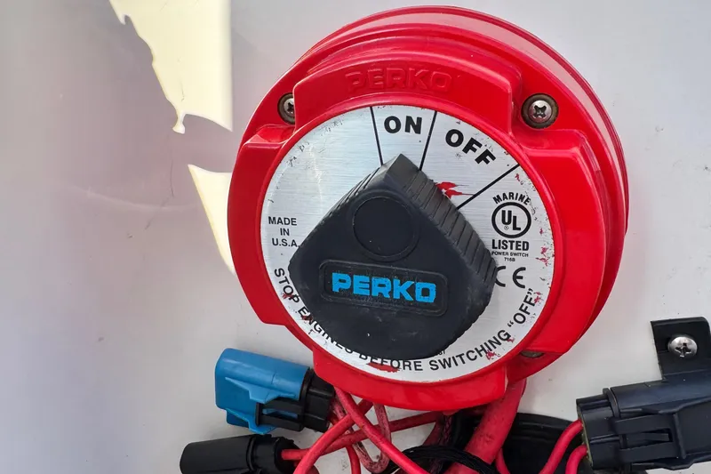 Slide: The Image of Red Perko marine battery switch on 2015 Epic 22 Sport Console boat. - 41