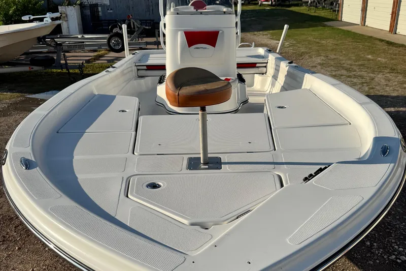 Slide: The Image of 2015 Epic 22 Sport Console boat with spacious deck and seating. - 7