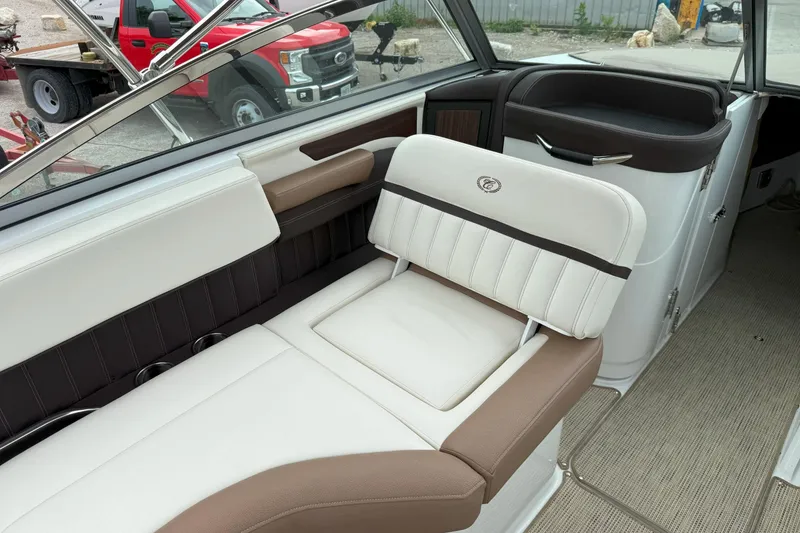 Slide: The Image of 2016 Cobalt 26SD boat interior with beige and brown seating, showcasing luxury design. - 15