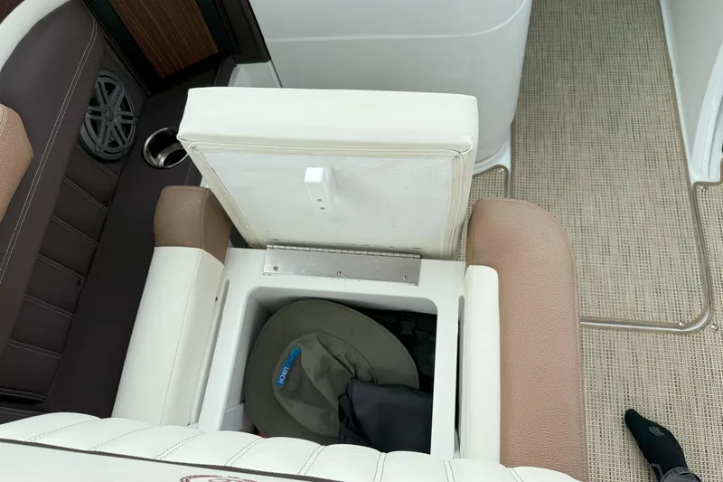 Slide: The Image of 2016 Cobalt 26SD boat interior with open storage compartment and seating. - 17