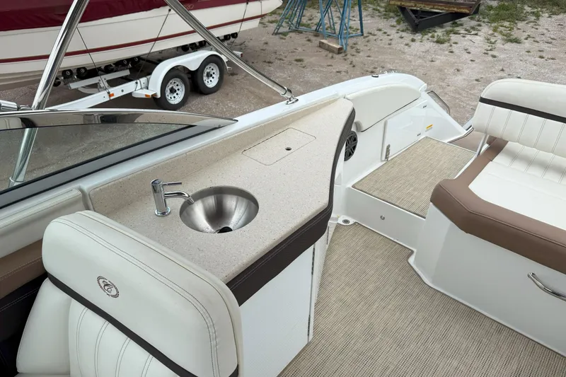 Slide: The Image of 2016 Cobalt 26SD boat interior with sink and seating area. - 19