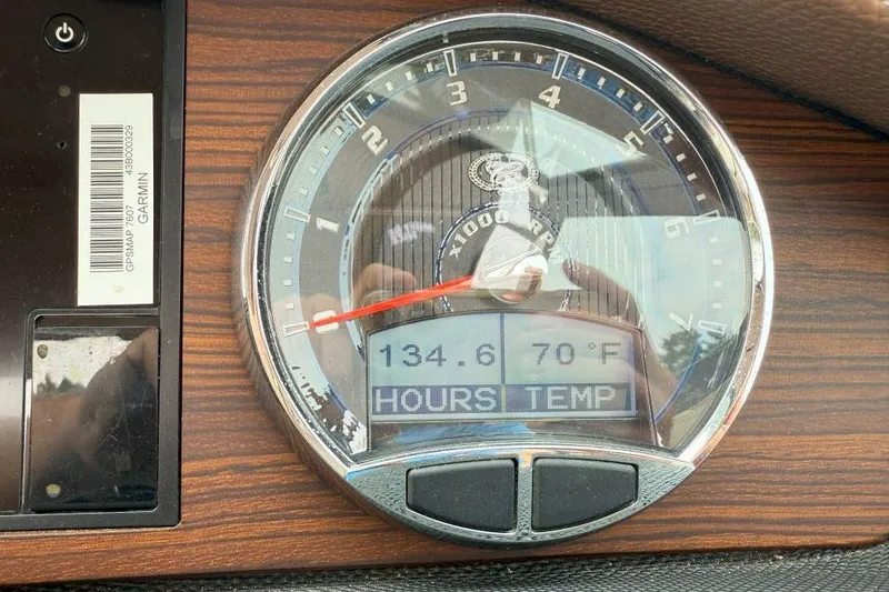 Slide: The Image of Dashboard of 2016 Cobalt 26SD showing 134.6 hours and 70°F temperature. - 23