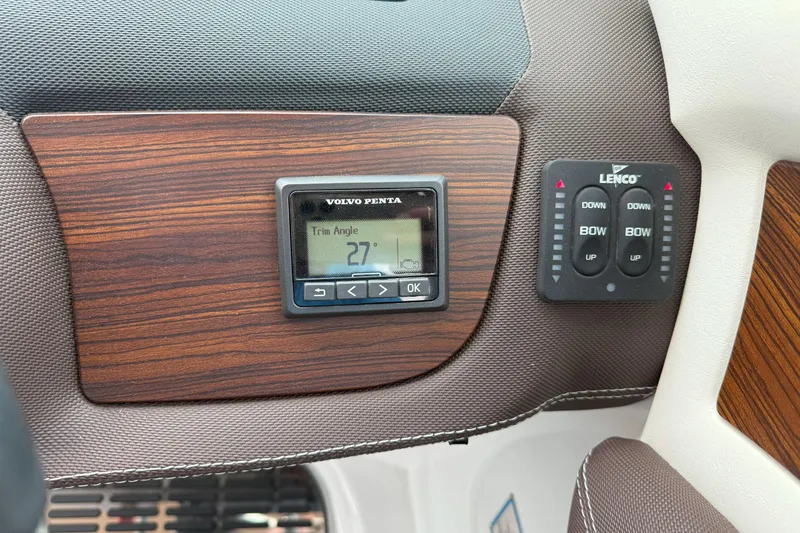 Slide: The Image of Control panel of a 2016 Cobalt 26SD boat with Volvo Penta and Lenco displays. - 24