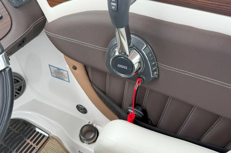 Slide: The Image of 2016 Cobalt 26SD boat throttle control with Volvo Penta branding and red safety lanyard. - 25