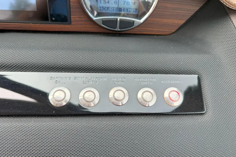 Slide: The Image of Control panel of a 2016 Cobalt 26SD boat with labeled buttons. - 26