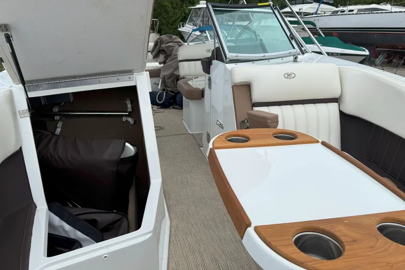 Slide: The Image of 2016 Cobalt 26SD boat interior with seating and storage compartments. - 38