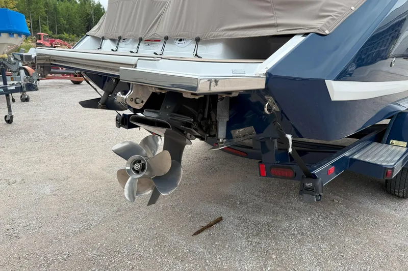 Slide: The Image of 2016 Cobalt 26SD boat rear view with propeller and trailer. - 4