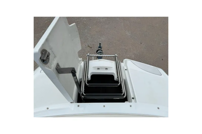 Slide: The Image of 2016 Cobalt 26SD boat with open storage compartment and ladder. - 41